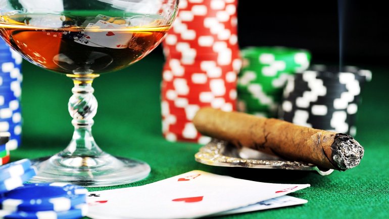 Cards, chips, a glass of cognac and a cigar