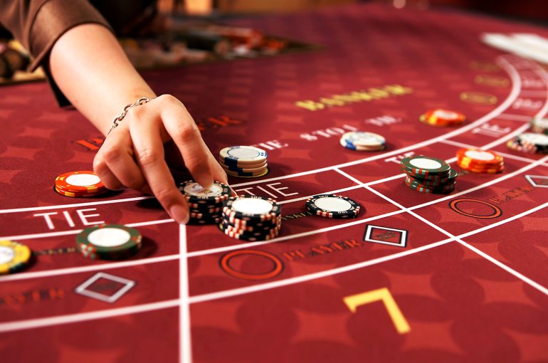 Players bets at baccarat
