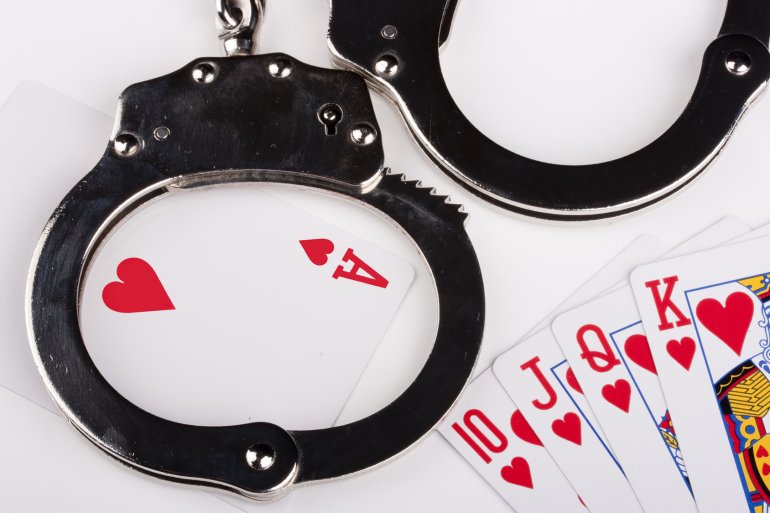 playing cards and handcuffs