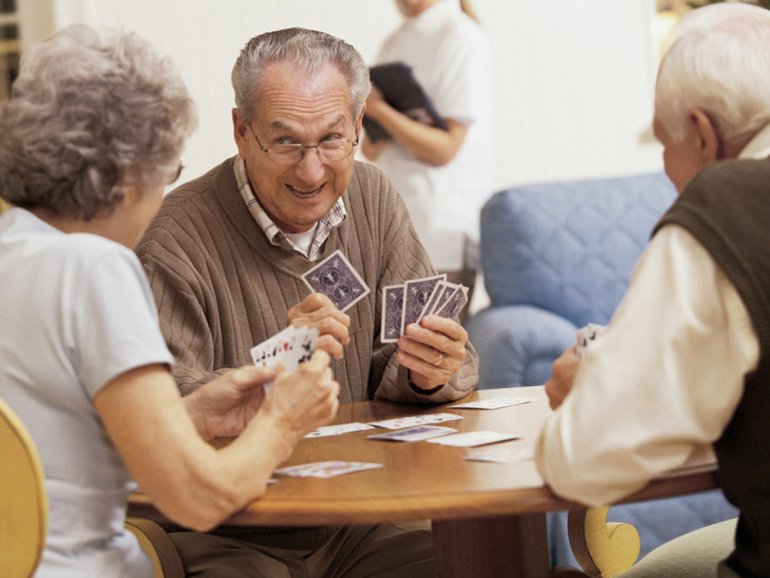 Elderly People Playing Cards