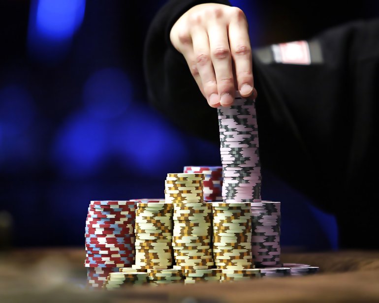 Stacks of casino chips of various denominations